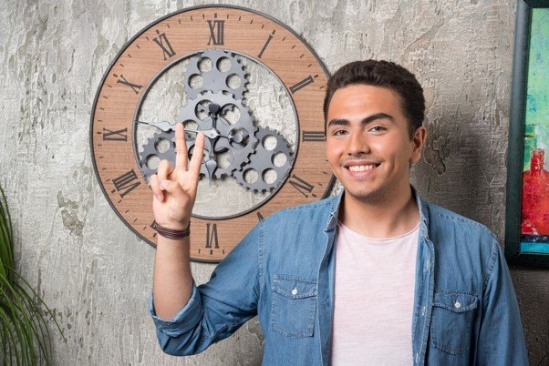young man showing two fingers